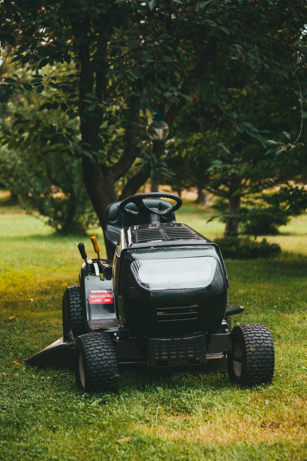 black-ride-on-toy-car-on-green-grass-field-during-daytime-fvtq-gfn6zy