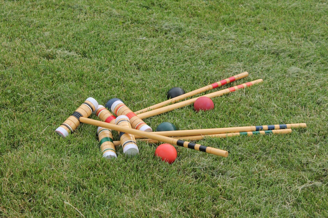 A set of croquet mallets and balls.